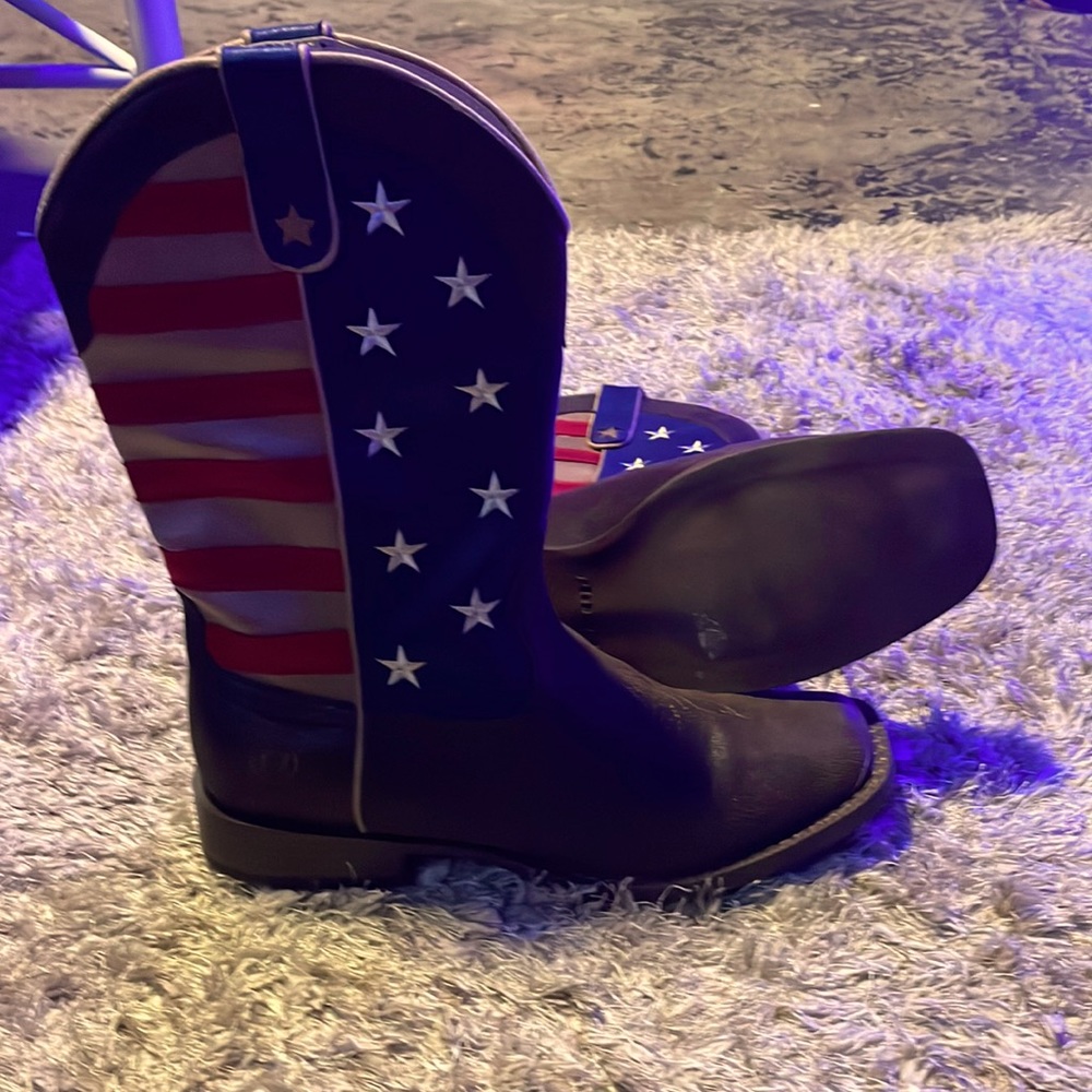 Cow boy boots never worn. Box is a little damaged but holds the boot fine
